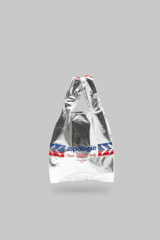 Silver reusable bag with Topologie branding on a gray background