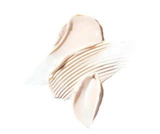 Close-up of beige eye cream on a white background