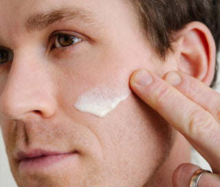 Close up of person applying serum