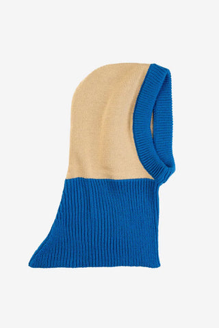Two-tone blue and beige knitted hood on a white background