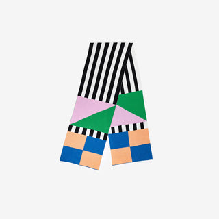 Geometric patterned scarf with black and white stripes, colorful triangles, and squares on a light gray background.