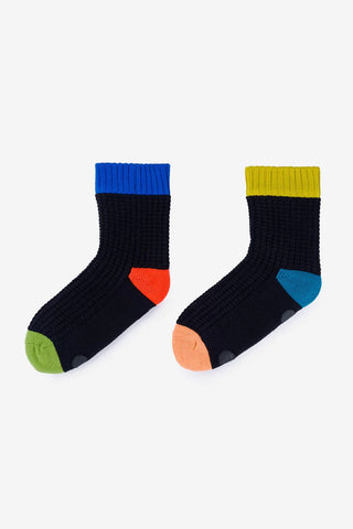 Pair of black socks with colorful accents on a white background
