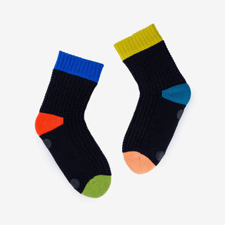 Two socks with colorful accents on a white background