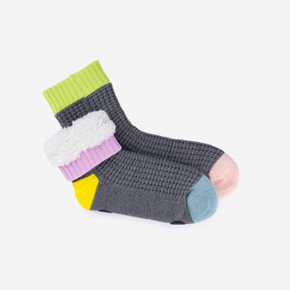 Colorful socks with a textured pattern on a white background