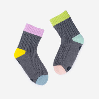 Pair of socks with colorful accents on a white background