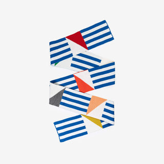 Colorful striped fabric scarf with geometric patterns on a white background