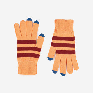 Pair of striped gloves with touch screen tips on a light gray background