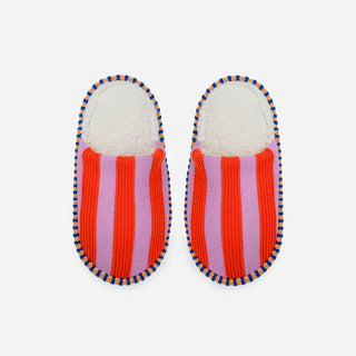 Pair of striped slippers with red and pink pattern on a white background