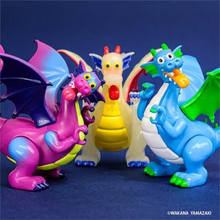 Colorful toy dragons on a dark blue background