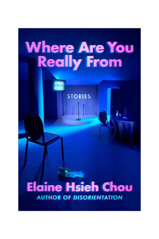 Book cover for 'Where Are You Really From: Stories' by Elaine Hsieh Chou, featuring a dark blue lit room with chairs, a table, and a stage-like backdrop, with the title in pink text.