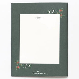 Green card with floral designs on a white background