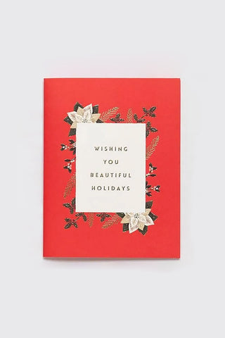 Red card with floral design and 'Wishing you beautiful holidays' text on a white background