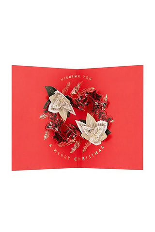 Red Christmas card with floral design and 'Wishing You a Merry Christmas' text on a white background