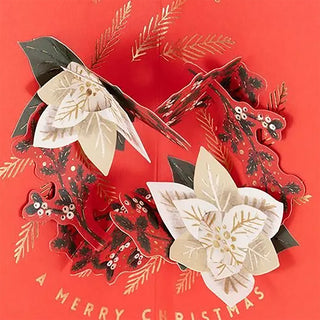 Decorative Christmas card with floral designs on a red background