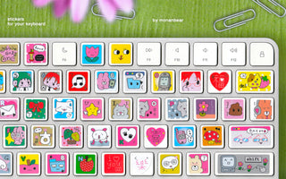 Keyboard with colorful stickers on a green background