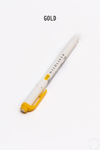 White pen with yellow cap on a white background, labeled 'Gold'.