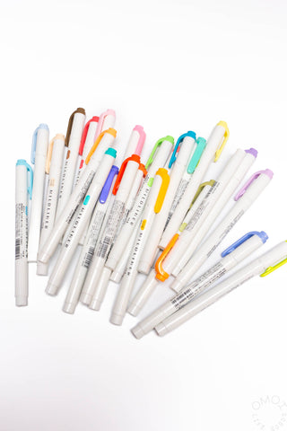 Set of colorful markers on a white background