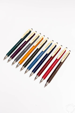 Set of multicolored pens on a white background