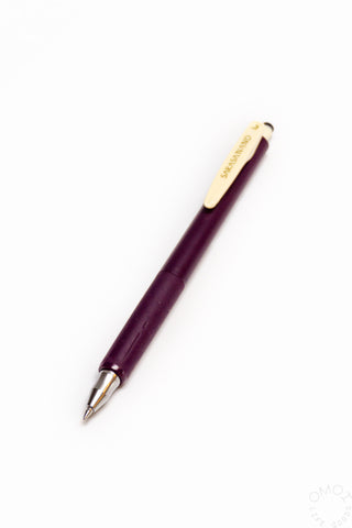 Purple pen on a white background