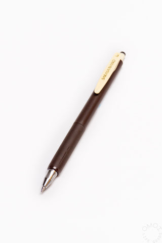 Brown pen on a white background