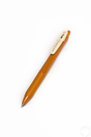 Yellow pen with a white clip on a white background