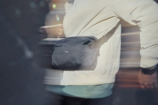 Person holding a bag with a blurred background