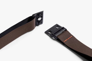 Bag strap with metal clasp on a white background