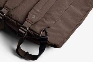 Brown bag with straps on a light gray background