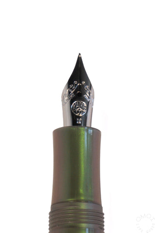 close up of a shadow green kaweco fountain pen nib on a white background