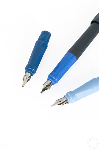 three fountain pen nibs in blue on a white backgroud