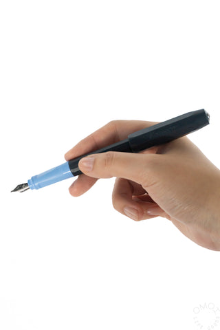 hand holding a PERKEO blue and black fountain pen on a white background