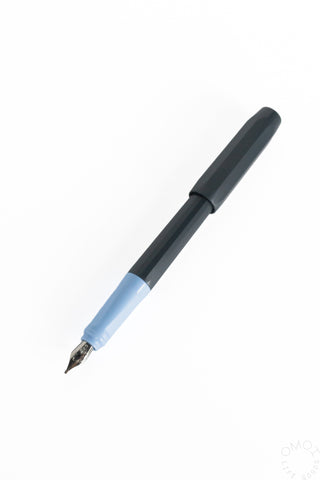 a fountain pen with a grey black body and blue accent on a white background