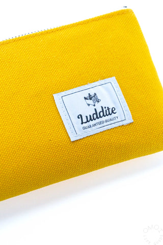 Close-up of Luddite bright yellow pen case on a white background 