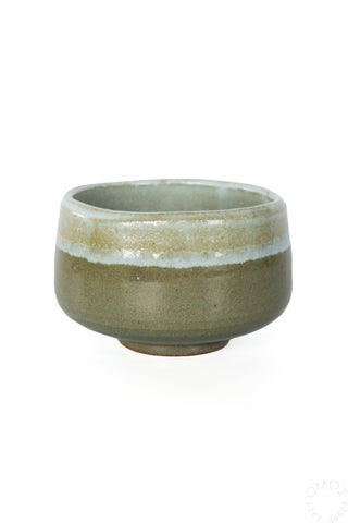 Olive green ceramic matcha chawan bowl on a white background