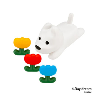 White dog figurine with colorful flowers on a white background