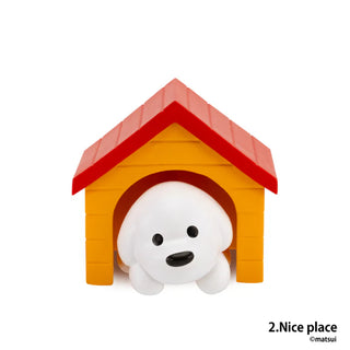 Small white dog with a red and orange doghouse on a white background