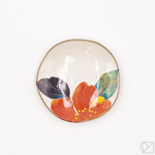 Decorative ceramic dish with colorful flower design on a white background