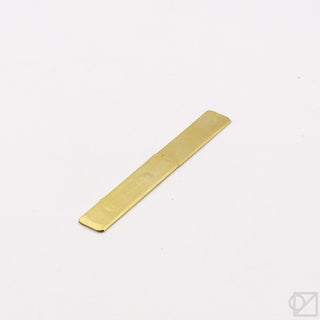 Brass rectangular knife on a white background