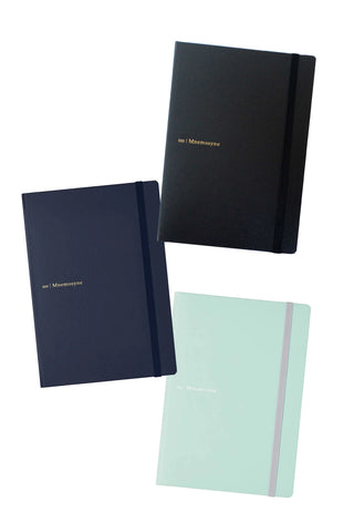 3 mnemosyne A5 hardcover notebooks in black, navy, and mint green on a white background