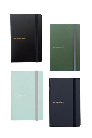 4 mnemosyne A6 notebooks in different colors on a white background
