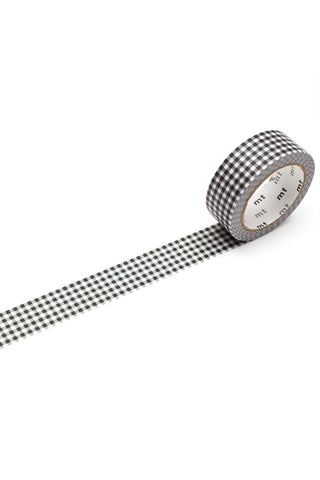 Roll of black and white checkered tape on a white background