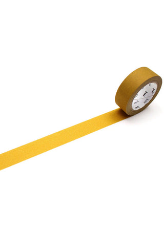Mustard colored washi tape rolled out 