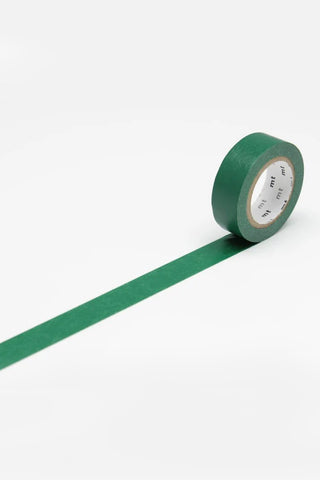Dark green washi tape roll on a white background