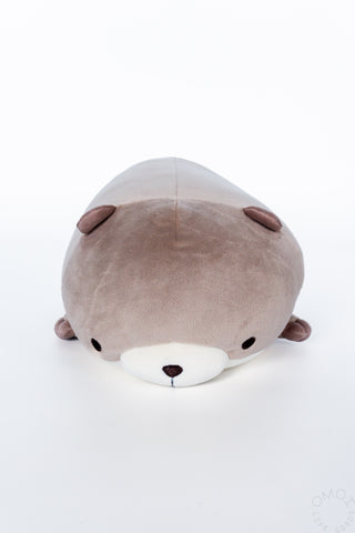 Brown otter plush on a white background