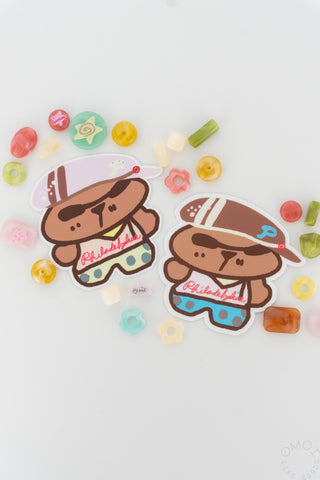 Two bear stickers on a white background surrounded by colorful beads