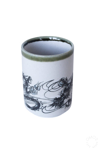 Ink dragon teacup, light blue ceramic with green rim and black dragon scene