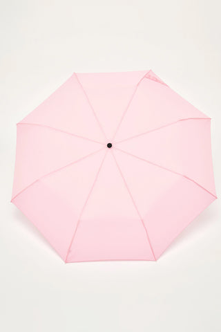 Pink umbrella on a white background