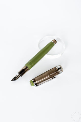 Sailor green fountain pen with cap on a white background