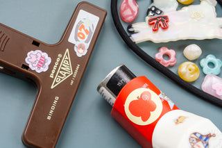 Close up of inhaler and penco clampy decorated with stickers on a blue background