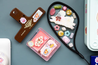 Sheep clip, brown penco clampy, and pink case on a blue background